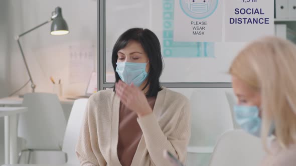 Sick Female Patient in Mask Coughing in Clinic alt