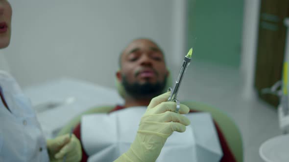 Dentist Makes an Injection To Young Man  alt