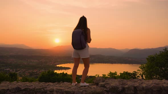 Girl at Red Sunset in the Mountains alt