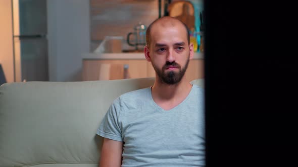 Tired Man Working on Project for Internet Communication Using Laptop Computer alt