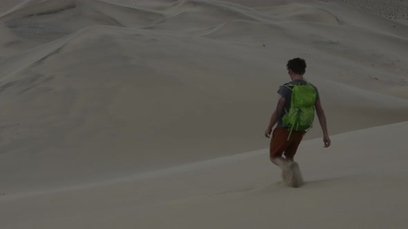 Hiker descends Eureka Dunes - Death Valley National Park alt