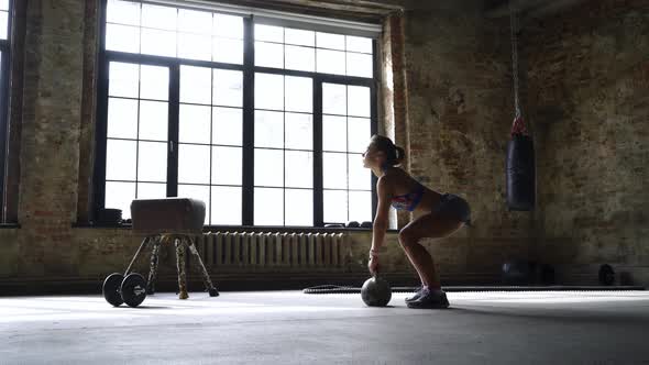 Athletic Female in the Modern Gym