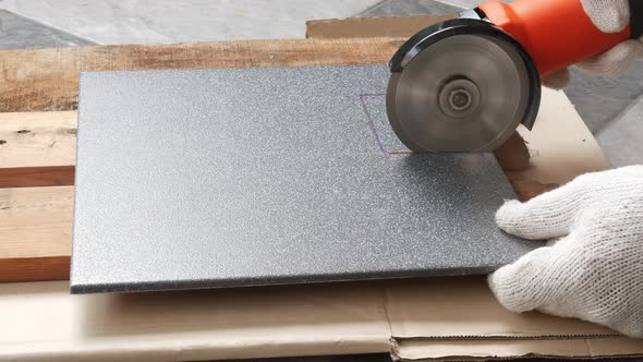 Cut the tiles with an electric grinder.