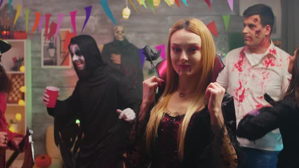 Sexy Blonde in Enchantress Costume at Halloween Party alt