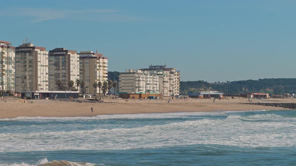 View of the Seixal Beach in Portugal, Lisbon, on a sunny winter day.  alt