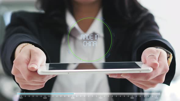Word MADE IN CHINA on the Virtual Screen in the Hands of a Girl. Future Concept HUD Elements