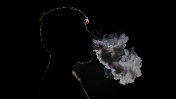 Exhaling Smoke on Nose Nostrilsand Then From the Mouth. Black ...