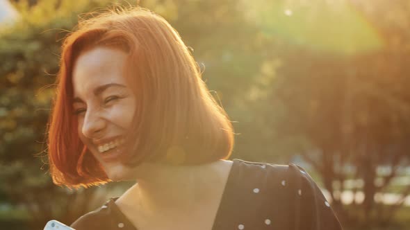 Attractive Teen Redhead Girl Active Carefree Woman Listens Music on Mobile Phone Sound App Dancing alt