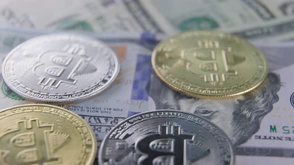 Bitcoin Coins Lie on Dollars