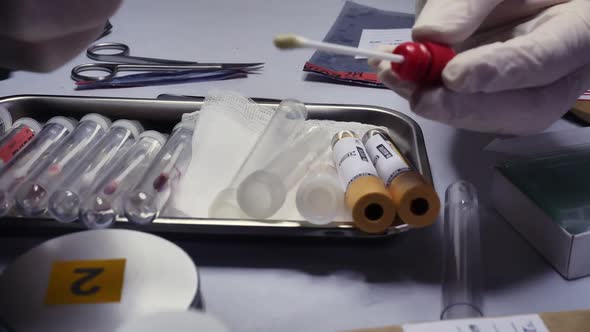 Swabs with Blood Sample to be Analyzed in Laboratory with UV Light