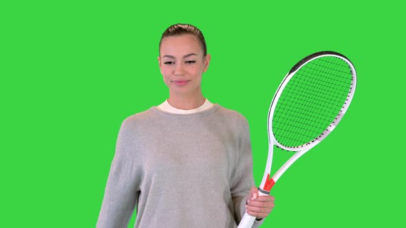 Female Tennis Player Walking and Tossing a Ball Up on a Green Screen Chroma Key alt