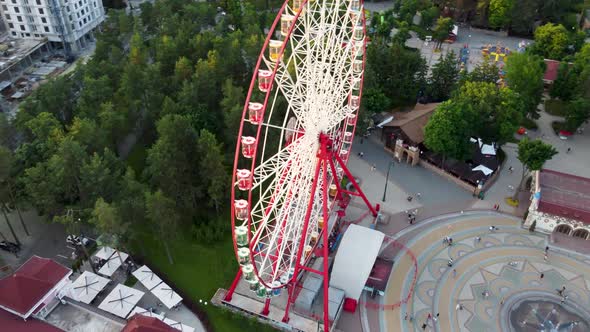 Ferris wheel in city park, aerial sunset, Kharkiv