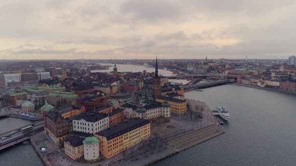 Flying over Stockholm city. Aerial view of Old Town and Riddarholmen cityscape skyline