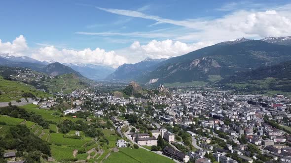 View from a drone of the beautiful city of Sion in the mountains in southern Switzerland, beautiful alt