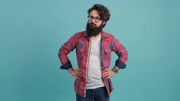 Young Bearded Man with Bad Attitude Making Stop Sign with Hand alt