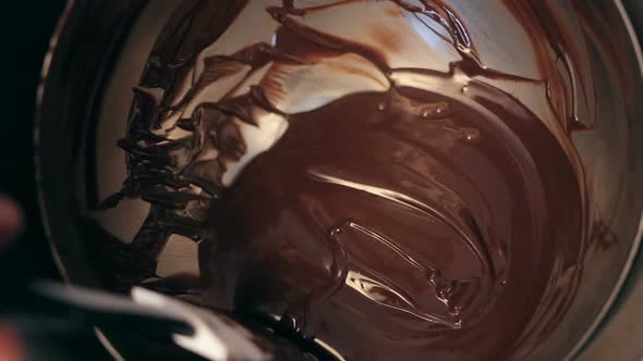 Chef Baker Mixing Sweet Delicious Organic Melted Chocolate in Bowl