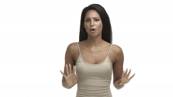 Serious Africanamerican Female Model in Beige Tank Top Shaking Hands and Saying No Decline Bad Idea alt