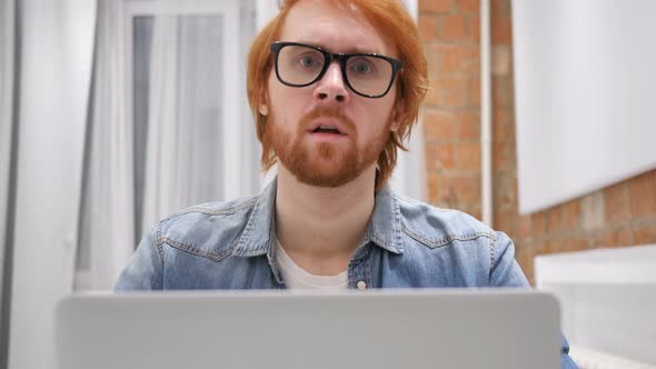 Shaking Head to No, Redhead Beard Man Working on Laptop alt