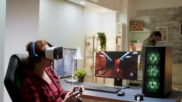 Side View of Woman with Red Hair Wearing Vr Goggles alt