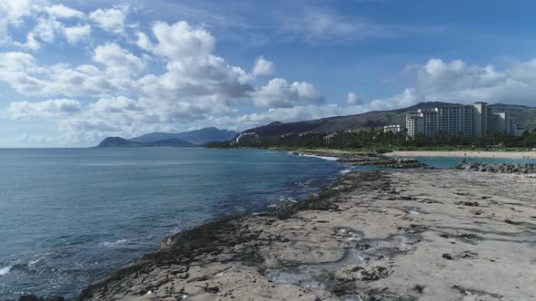 Aerial Dolly motion rocky coastline shore, Ko Olina resort area. Oahu. Hawaii alt