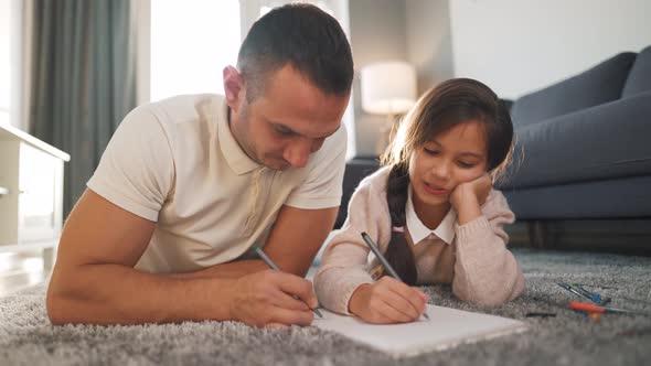 Father and Daughter Communicate Having Fun and Painting Together alt