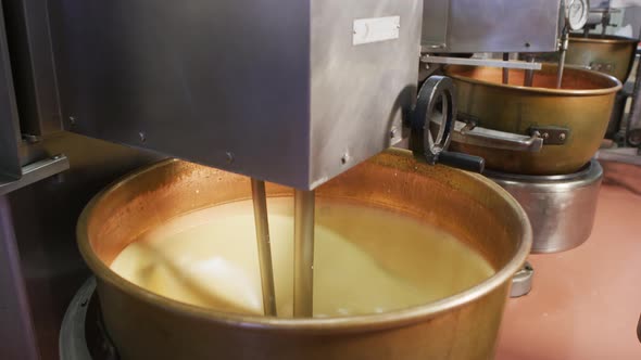 Mixing ingredients for chocolate fudge at candy factory