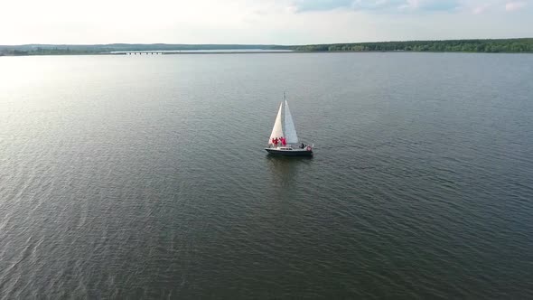 Women in Red Clothing Traveling on Sailing Boat alt