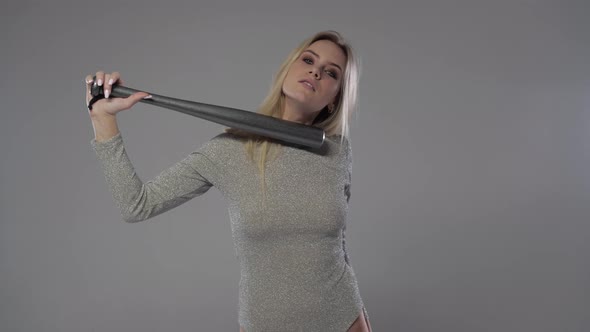 Blonde Woman Posing with a Bat
