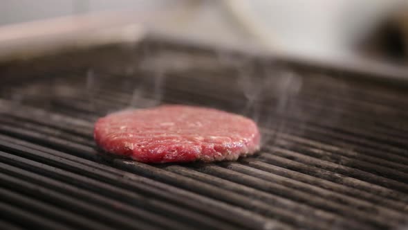 Burger Meat Cooking on A Kitchen Grill
