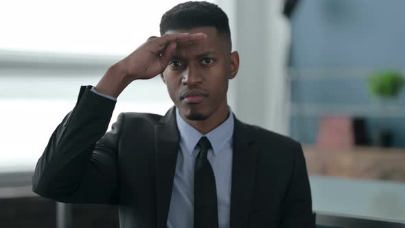 Portrait of African Businessman Looking Around, Searching alt