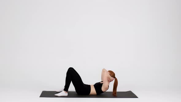 Sporty Young Woman Doing Abs Crunches Exercises Training Abdominal Muscles In Studio alt