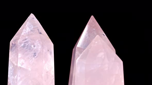 Three Rose Quartz and Crystal on Rotates on a Black Background alt