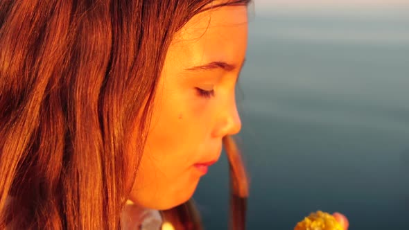 Happy Girl Eating Corn alt