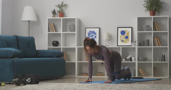 Young Sexy Lady Is Training Ass and Legs Doing Exercises with Fitness Elastic Band Home Workout alt