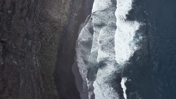 Remote Beach Of Playa Nogales With Black Volcanic Sand And Strong Waves In La Palma, Spain. aerial alt