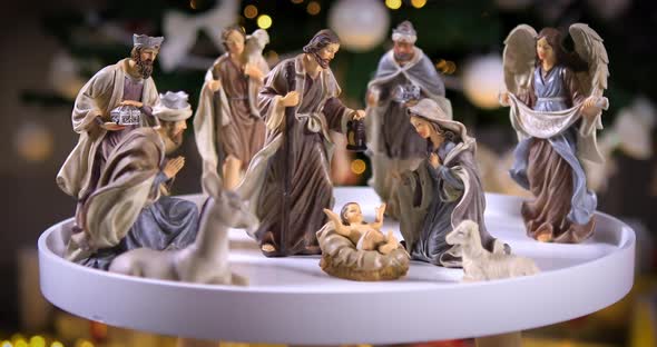 Nativity Scene in front of Christmas Tree 