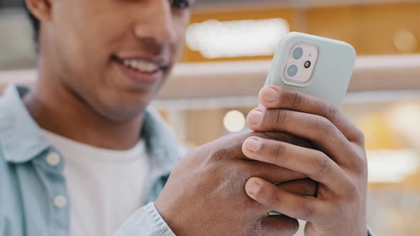 Smiling Unrecognizable Businessman Indoors Reading Phone Message Downloading App Mobile Phone alt