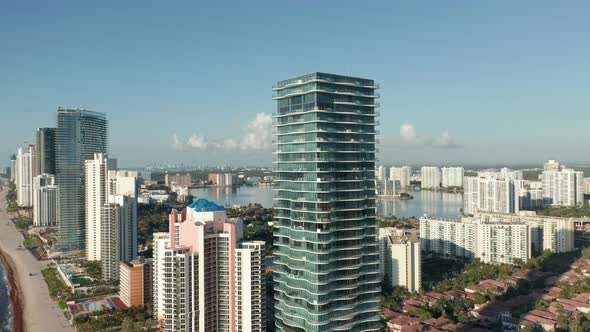 Drone Is Flying Around Modern Condo Building with Ocean View Apartments alt