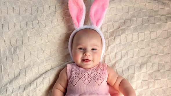 Funny Little Child is Wearing Bunny Ears alt