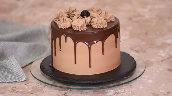Delicious Chocolate Cake with Prunes on Rotating Cake Stand
