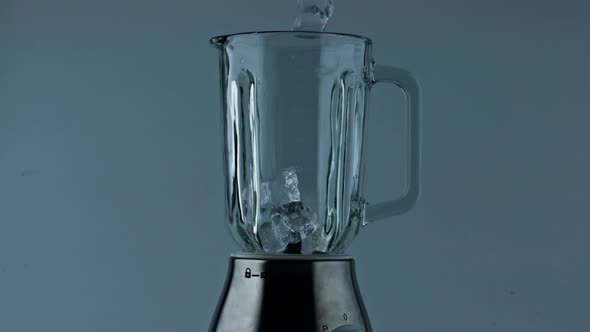 Ice Cubes Falling Mixer Bowl Close Up alt