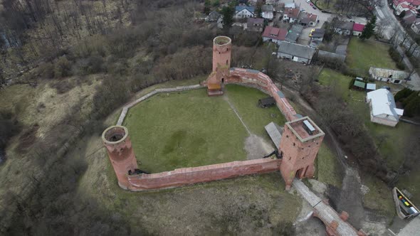 Drone Aerial View of Czersk Castle in Gora Kalwaria Poland during clear daytime alt