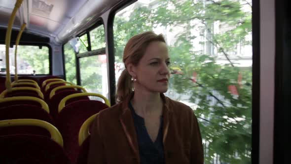 Woman sitting in bus during business trip