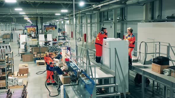 Factory Staff Are Manually Fabricating Fridges alt