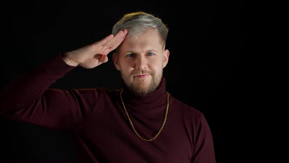 Serious Executive Handsome Man Ready to Get to Work and Follow Instructions Saluting with Smile alt