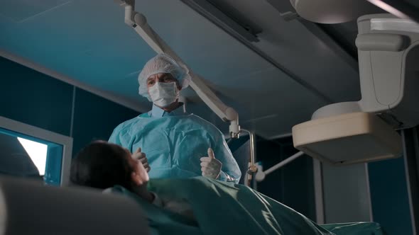 Surgeon Explains Treatment Plan for Patient on Operating Table alt