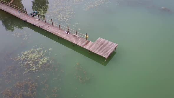 Aerial Video Filming of Wooden Pier on the Lake. alt