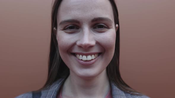 Close Up Young Adult Woman Dressed in Suit Smiling and Looking at Camera alt
