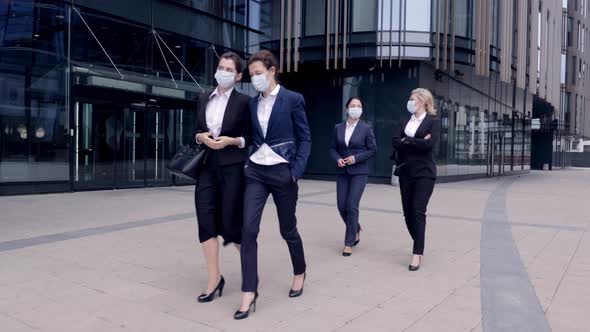 Group of Business Women in Protective Mask Walk Outside Office Building. Corporate People Having