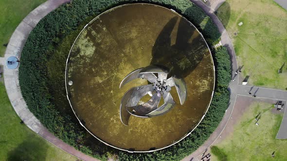 Descending aerial top down shot of floralis generica monument in Buenos Aires,Argentinia alt